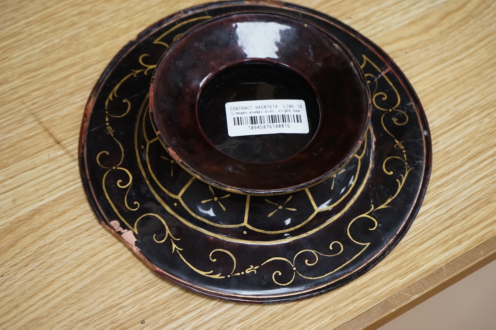 A Limoges style enamel on copper dish, decorated with a portrait of a gentleman in profile, 22cm in diameter